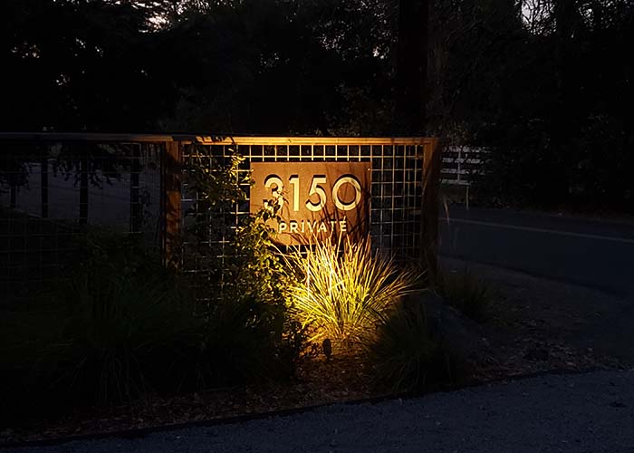 Landscape lighting on address sign