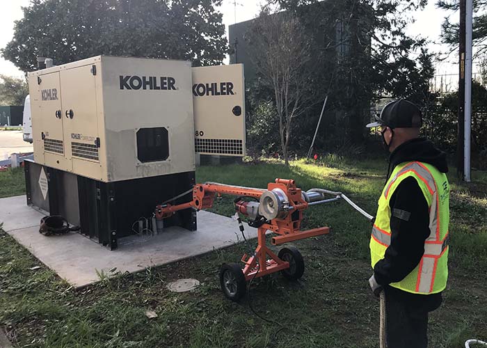 Large generator being moved by an electrician