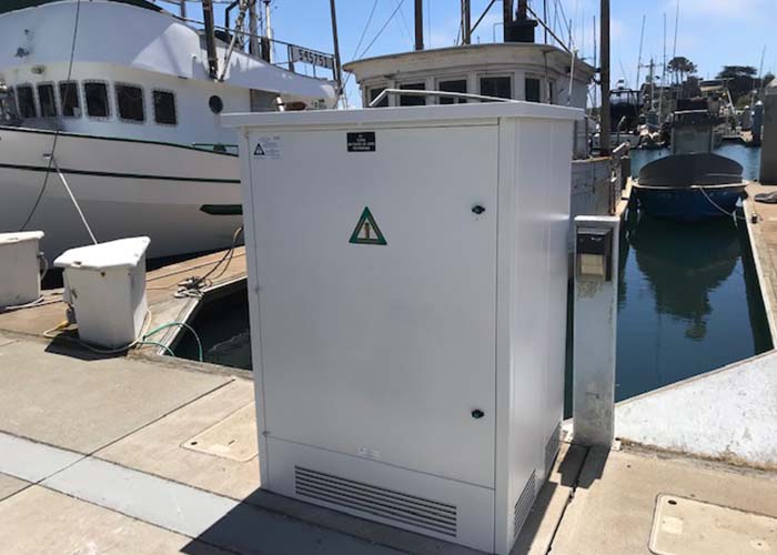 Large electrical box on boat dock in a marina