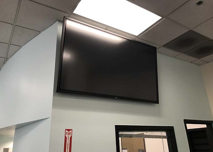 Conference room with a TV mounted on the wall